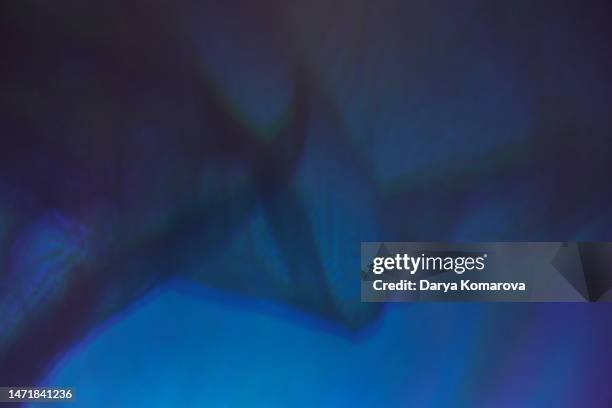 the shadow of an abstract transparent plastic with an unusual blue coloured light. сoncept of a digital art, wave pattern with copy space. trendy colour. - royal blue imagens e fotografias de stock