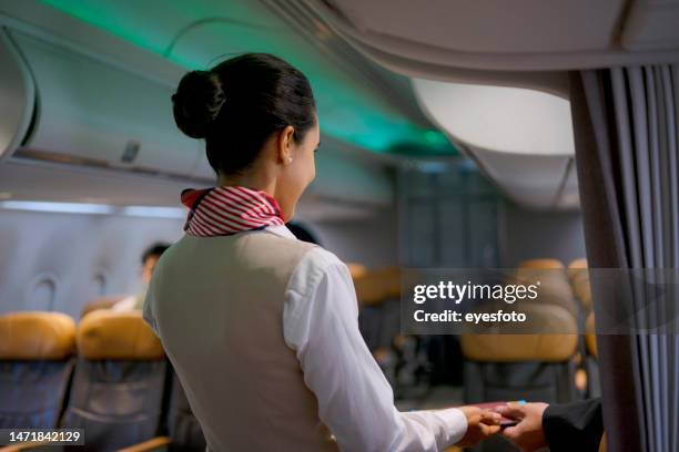 passenger travel via commercial air plane. - air stewardess stockfoto's en -beelden