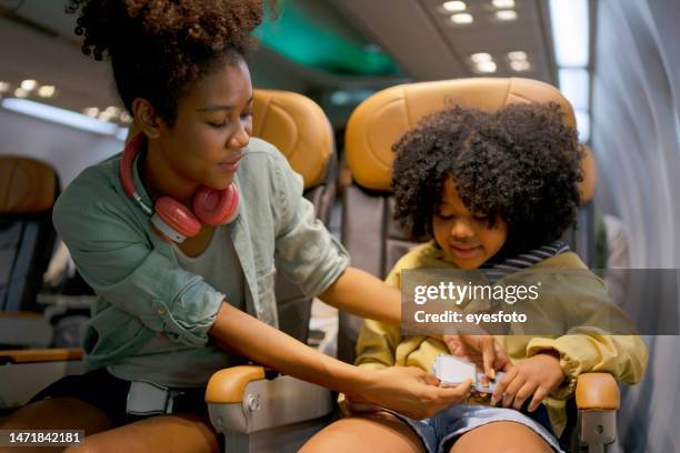 passenger travel via commercial air plane. - kid flying stock pictures, royalty-free photos & images