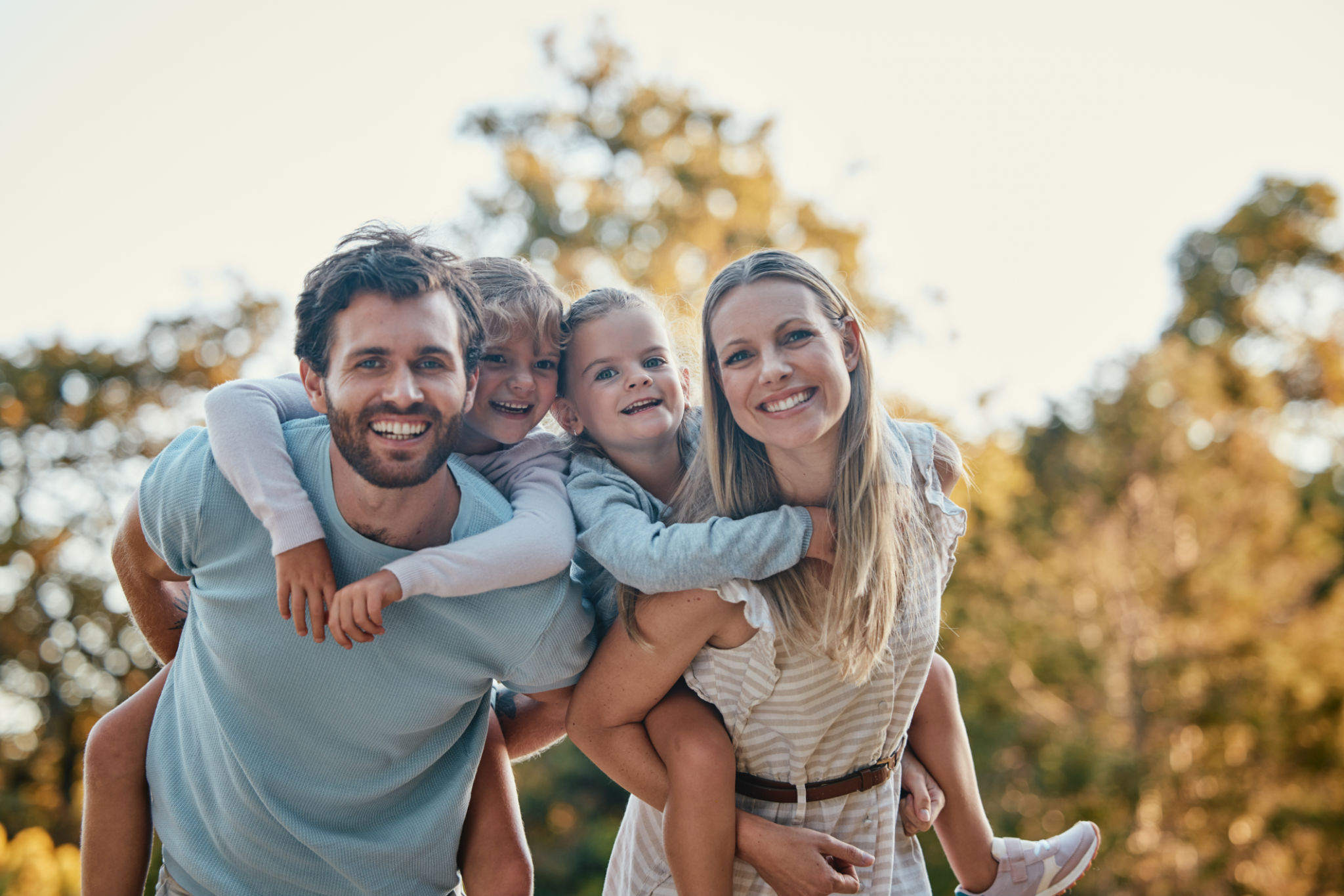 Family, park and portrait of parents with kids enjoying summer holiday, weekend and quality time outdoors. Love, nature and happy mother, father and children smiling, bonding and relax together Family, park and portrait of parents with kids enjoying summer holiday, weekend and quality time outdoors. Love, nature and happy mother, father and children smiling, bonding and relax together