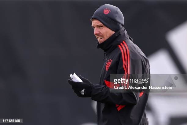 Julian Nagelsmann, head coach of FC Bayern München looks on during a training session ahead of their UEFA Champions League round of 16 match against...