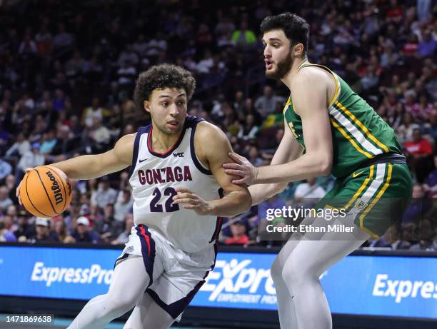 Anton Watson of the Gonzaga Bulldogs drives to the basket against Saba Gigiberia of the San Francisco Dons in the second half of a semifinal game of...