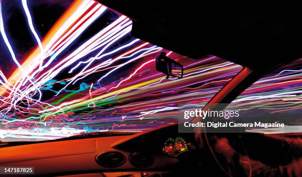 Traffic light trails seen from inside a moving car, taken on September 21, 2008.