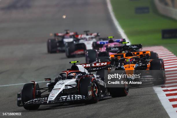 Yuki Tsunoda of Japan driving the Scuderia AlphaTauri AT04 and Oscar Piastri of Australia driving the McLaren F1 Team MCL60on track during the F1...