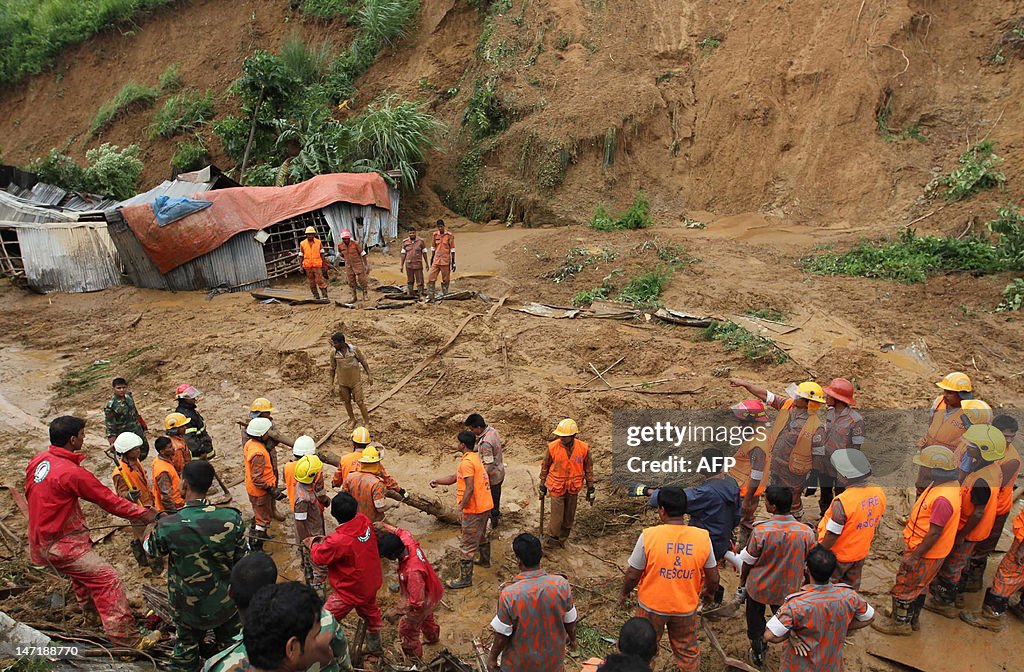 Bangladeshi fire fighters search for bod