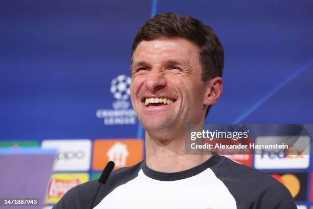 Thomas Müller of FC Bayern München smiles during a FC Bayern München press conference ahead of their UEFA Champions League round of 16 match against...