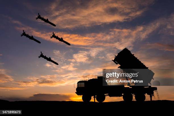 surface-to-air defense missile system on the background of the sunset - bomb stock pictures, royalty-free photos & images