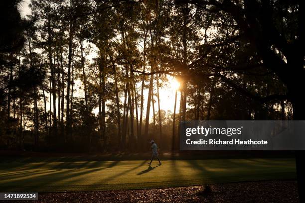 Michael Greller, caddy for Jordan Spieth, checks out the course in the early morning light prior to THE PLAYERS Championship on THE PLAYERS Stadium...