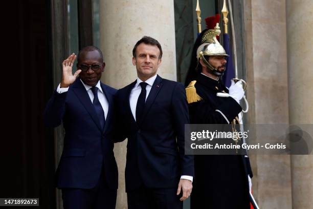 French President Emmanuel Macron greets the President of Benin Patrice Talon, prior to a working lunch at the Elysee Palace on March 7, 2023 in...