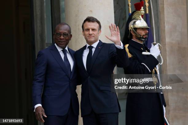 French President Emmanuel Macron greets the President of Benin Patrice Talon, prior to a working lunch at the Elysee Palace on March 7, 2023 in...