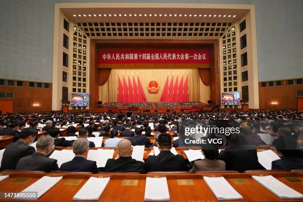 Deputies to the 14th National People's Congress attend the second plenary meeting of the first session of the 14th National People's Congress at the...