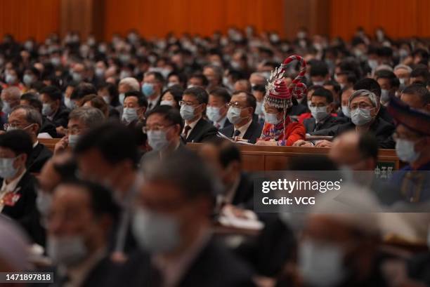 Members of the 14th National Committee of the Chinese People's Political Consultative Conference attend the opening meeting of the first session of...