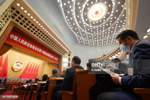 Members of the 14th National Committee of the Chinese People's Political Consultative Conference attend the opening meeting of the first session of...