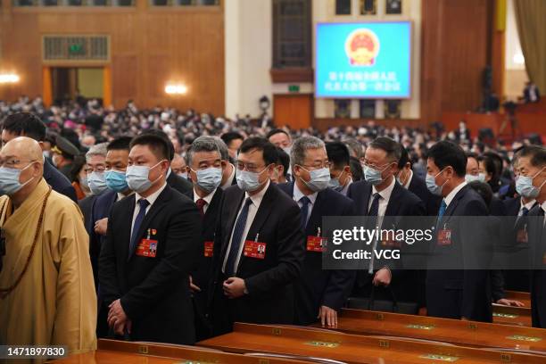 Members of the 14th National Committee of the Chinese People's Political Consultative Conference attend the opening meeting of the first session of...