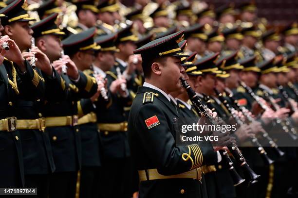 Members of a military band attend the opening meeting of the first session of the 14th National Committee of the Chinese People's Political...