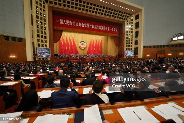 Members of the 14th National Committee of the Chinese People's Political Consultative Conference attend the opening meeting of the first session of...