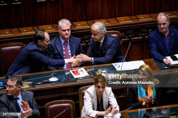 Italian Interior Minister Matteo Piantedosi greets Italian Minister for Relations with Parliament Luca Ciriani during the informative debate about...