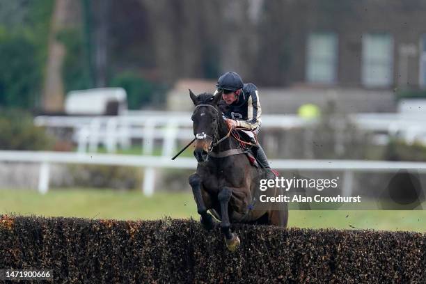 Lance Bombardier Jody Sole riding Broken Halo clear the last to win The Grand Military Gold Cup at Sandown Park Racecourse on March 07, 2023 in...