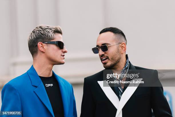 Two attendees wearing sunglasses at Melbourne Fashion Festival on March 07, 2023 in Melbourne, Australia.