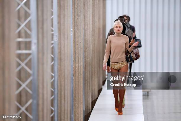 Emma Corrin walks the runway during the Miu Miu Womenswear Fall Winter 2023-2024 show as part of Paris Fashion Week on March 7, 2023 in Paris, France.