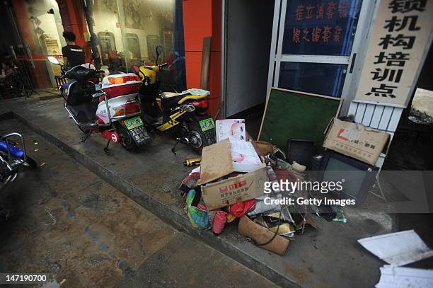 People salvage their belongings as flood waters recede on June 26, 2012 in Changde, China. Heavy rainstorms and gales have hit the Hunan province,...