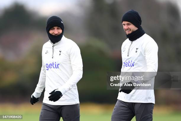 Harry Kane and Eric Dier of Tottenham Hotspur speak during a Tottenham Hotspur training session ahead of their UEFA Champions League round of 16...