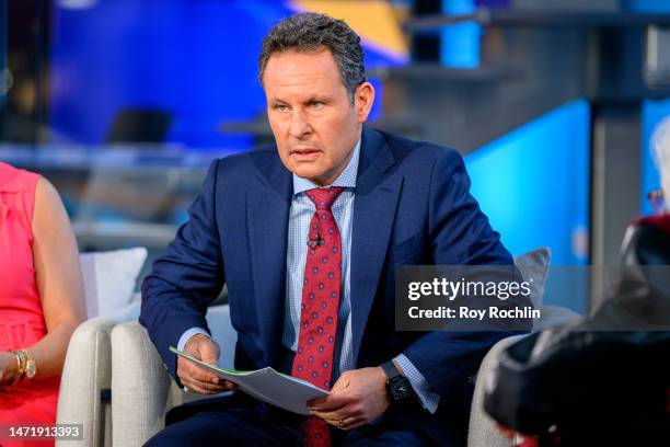 Host Brian Kilmeade as Jean Dolores Schmidt, also known as Sister Jean, visits "Fox & Friends" at Fox News Studios on March 07, 2023 in New York City.