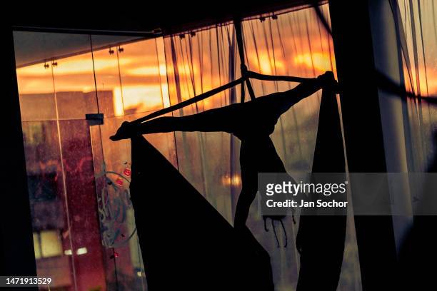 Colombian aerial dancer performs on aerial silks during a training session on November 11, 2022 in the Oshana gym in Barranquilla, Colombia. Aerial...
