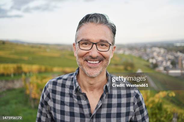 happy mature man wearing eyeglasses in front of sky - rheingau stock pictures, royalty-free photos & images