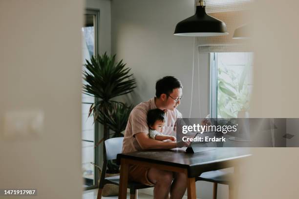 girl excited when she saw her dad buying her some new toy. - southeast asian ethnicity stock pictures, royalty-free photos & images