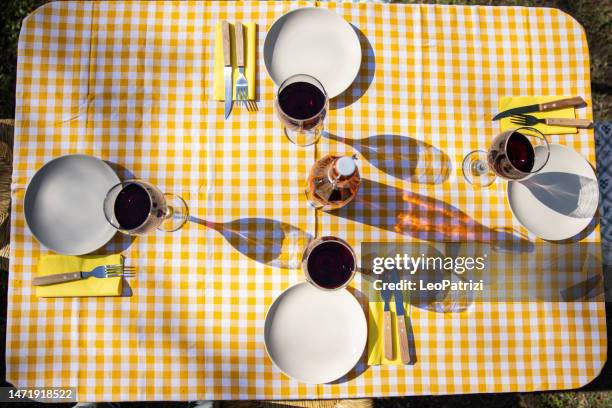picnic table set and ready for lunch - wine glass above stock pictures, royalty-free photos & images