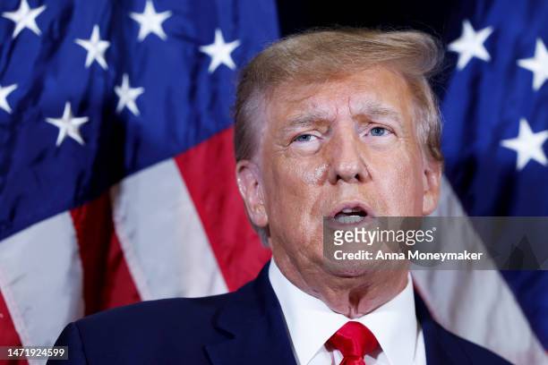 Former U.S. President Donald Trump speaks to reporters before his speech at the annual Conservative Political Action Conference at Gaylord National...