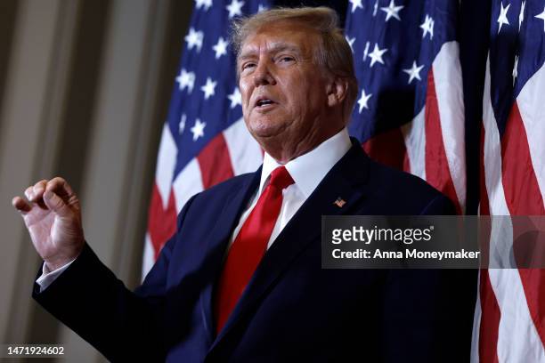 Former U.S. President Donald Trump speaks to reporters before his speech at the annual Conservative Political Action Conference at Gaylord National...