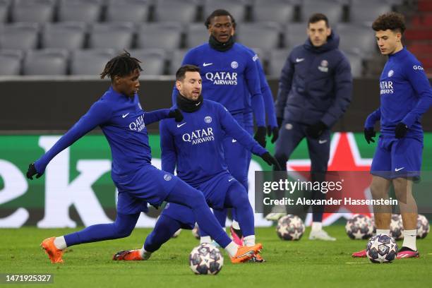 Lionel Messi of PSG Paris Saint-Germain plays the ball with his team mate Warren Zaïre-Emery during a Paris Saint-Germain Training session ahead of...