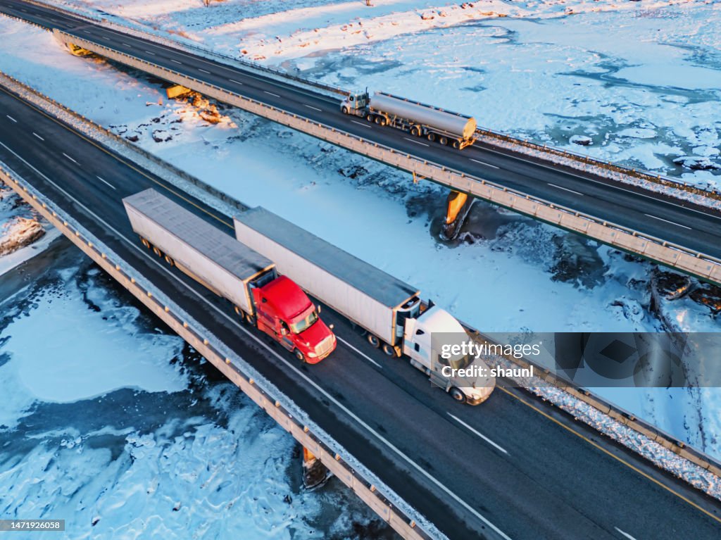 Semi Trucks Crossing Frozen River