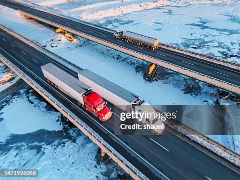 Semi Trucks Crossing Frozen River Semi Trucks Crossing Frozen River