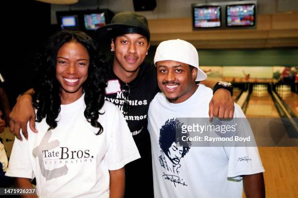 Actress Jill Marie Jones poses for photos with actors Wesley Jonathan and Larron Tate during the Tate Brothers Foundation Celebrity Weekend In...