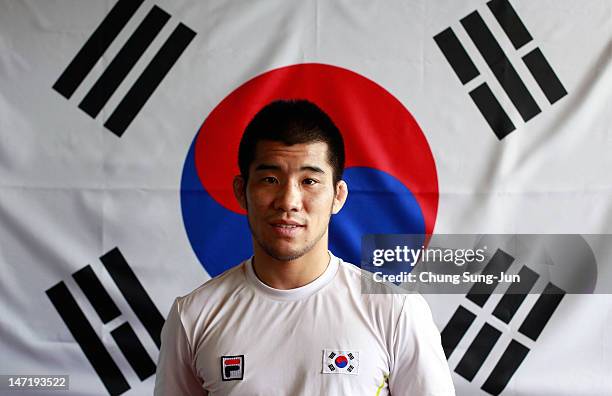 Choi Gyu-Jin of the South Korean Wrestling Team poses during the South Korea Olympic Team Media session at the Taereung Training Center on June 27,...