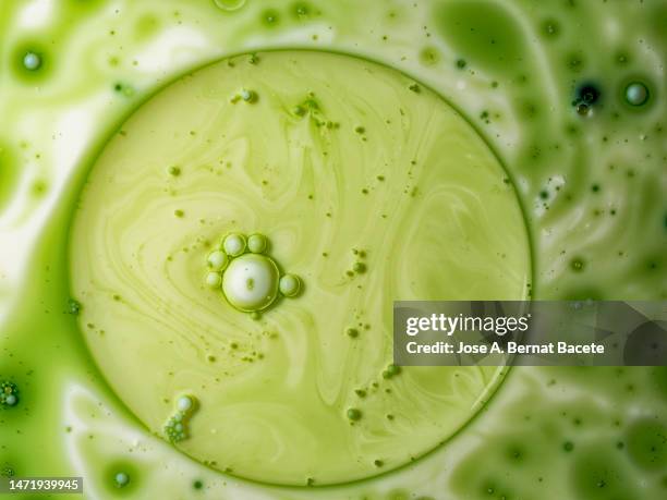 close-up of floating liquid cell. - covid particle stock pictures, royalty-free photos & images