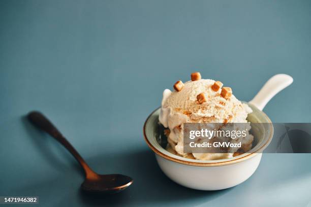 vanilla ice cream with caramel topping - caramel sauce stock pictures, royalty-free photos & images