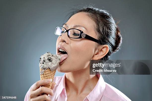 girl eating ice-cream - chocolate chip ice cream stock pictures, royalty-free photos & images