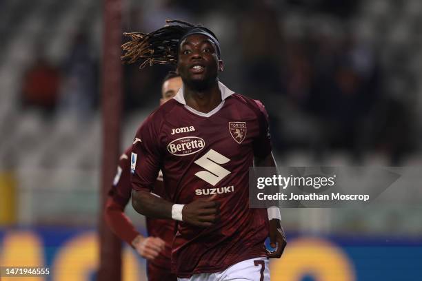 Yann Karamoh of Torino FC is pursued by team mate Antonio Sanabria as he celebrates after scoring to give the side a 1-0 lead during the Serie A...