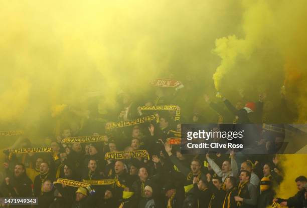 General view as fans Borussia Dortmund use smoke flares during the UEFA Champions League round of 16 leg two match between Chelsea FC and Borussia...