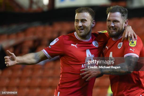James Norwood of Barnsley celebrates with teammate Herbie Kane of Barnsley after scoring the team's first goal during the Sky Bet League One between...