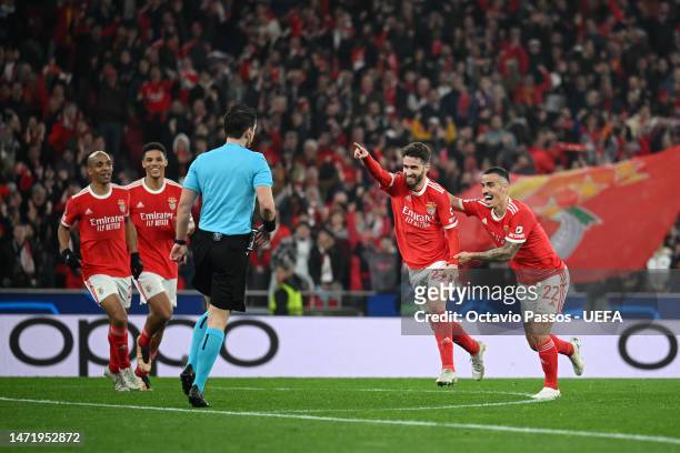 Rafa Silva of SL Benfica celebrates with teammate Chiquinho after scoring the team's first goal during the UEFA Champions League round of 16 leg two...