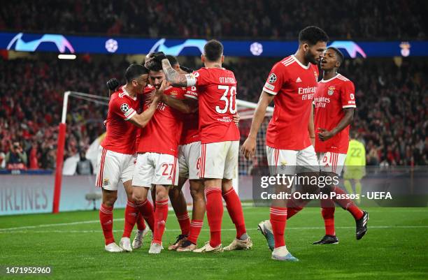 Rafa Silva of SL Benfica celebrates with teammates after scoring the team's first goal during the UEFA Champions League round of 16 leg two match...