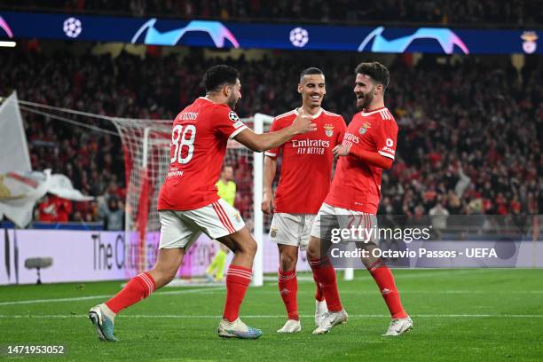 Rafa Silva of SL Benfica celebrates with teammates Goncalo Ramos and Chiquinho after scoring the team's first goal during the UEFA Champions League...