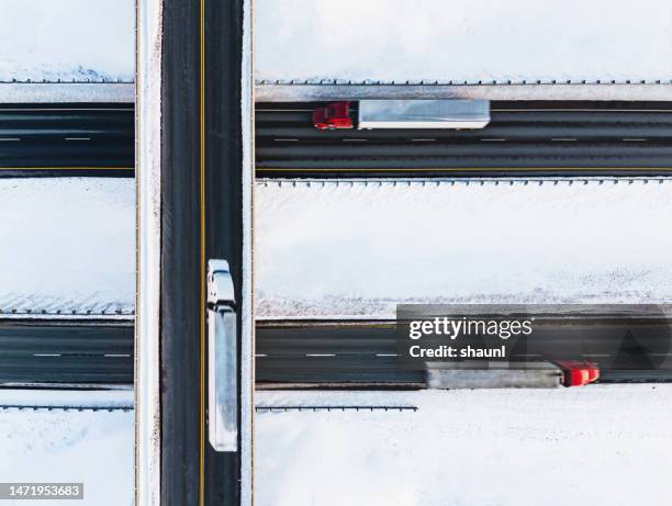 semi trucks cross paths - snow ramp stock pictures, royalty-free photos & images