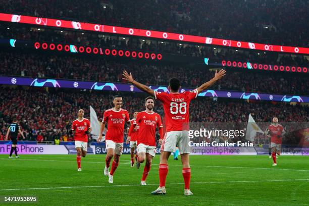 Rafa Silva of SL Benfica celebrates with teammates Goncalo Ramos and Chiquinho after scoring the team's first goal during the UEFA Champions League...