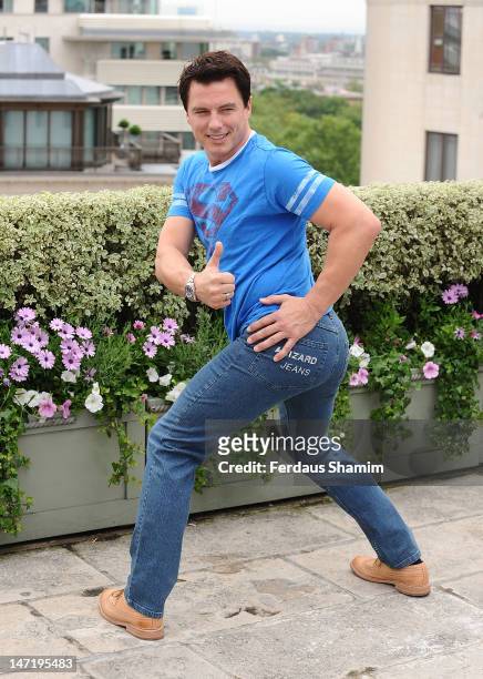 John Barrowman winner of Wizard Jeans Rear Of The Year Award 2012 attends a photocall at The Dorchester on June 27, 2012 in London, England.